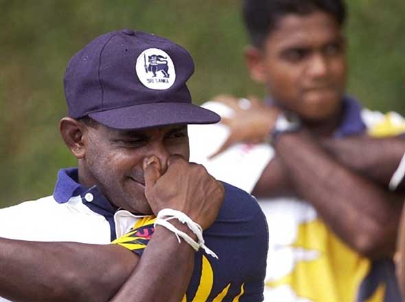 APH2001082057141-L.jpg Photo: Jayasuriya stretches whilst pinching his nose.