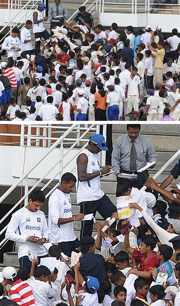 IC843009.jpg Sri Lanka cricketers sign autographs for fans