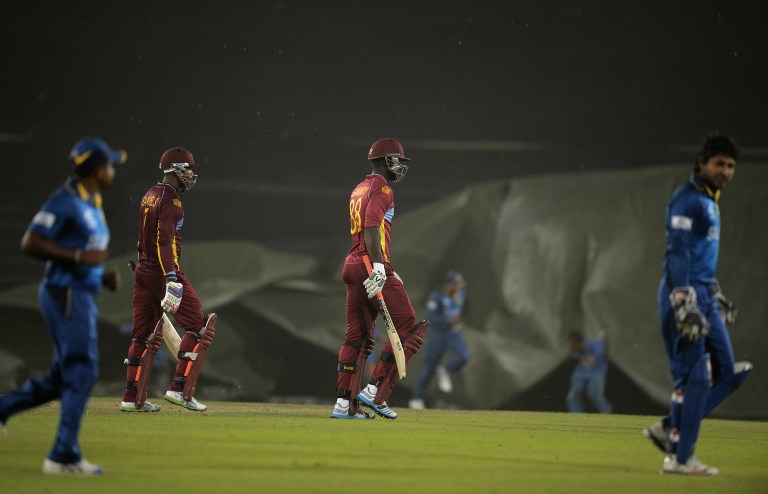 000_Del6306384.jpg Players walk off as rain stops play