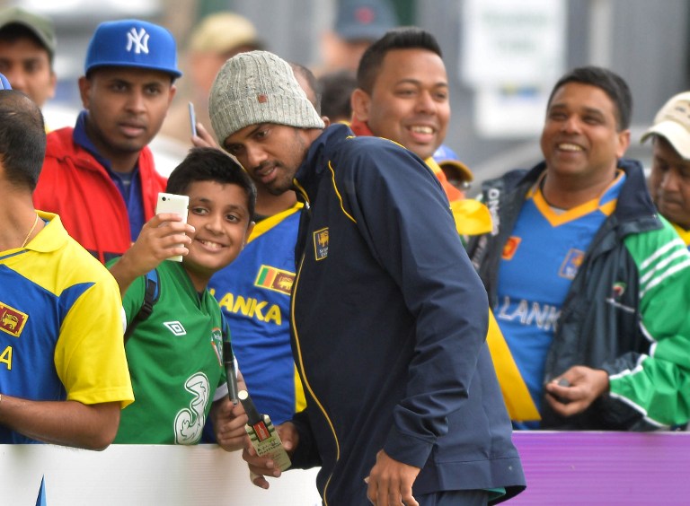 000_DV1719778.jpg Sachithra Senanayake poses for a photo with a fan in Ireland